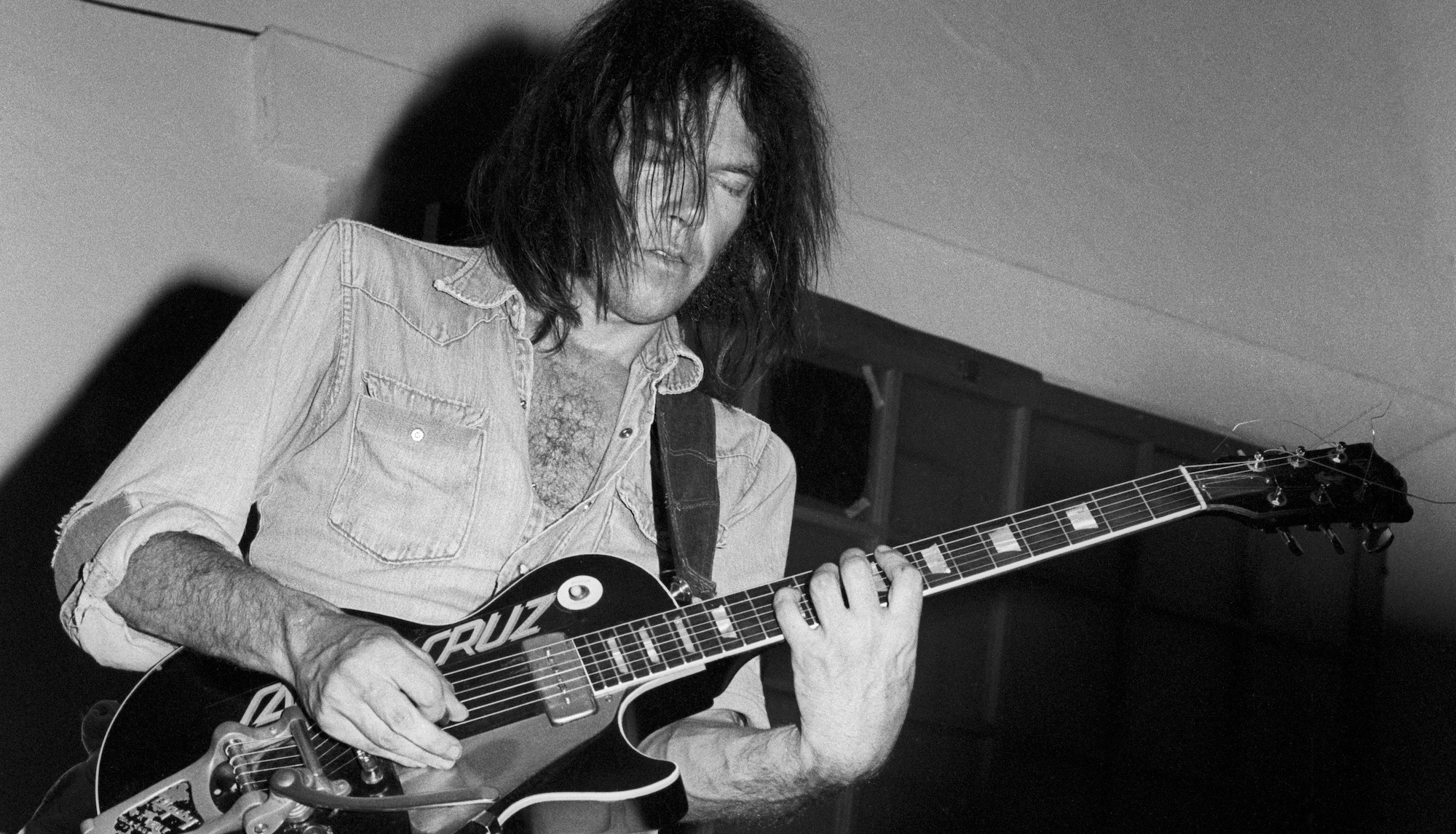 Neil Young performs onstage at the Catalyst in Santa Cruz, California on July 31, 1977